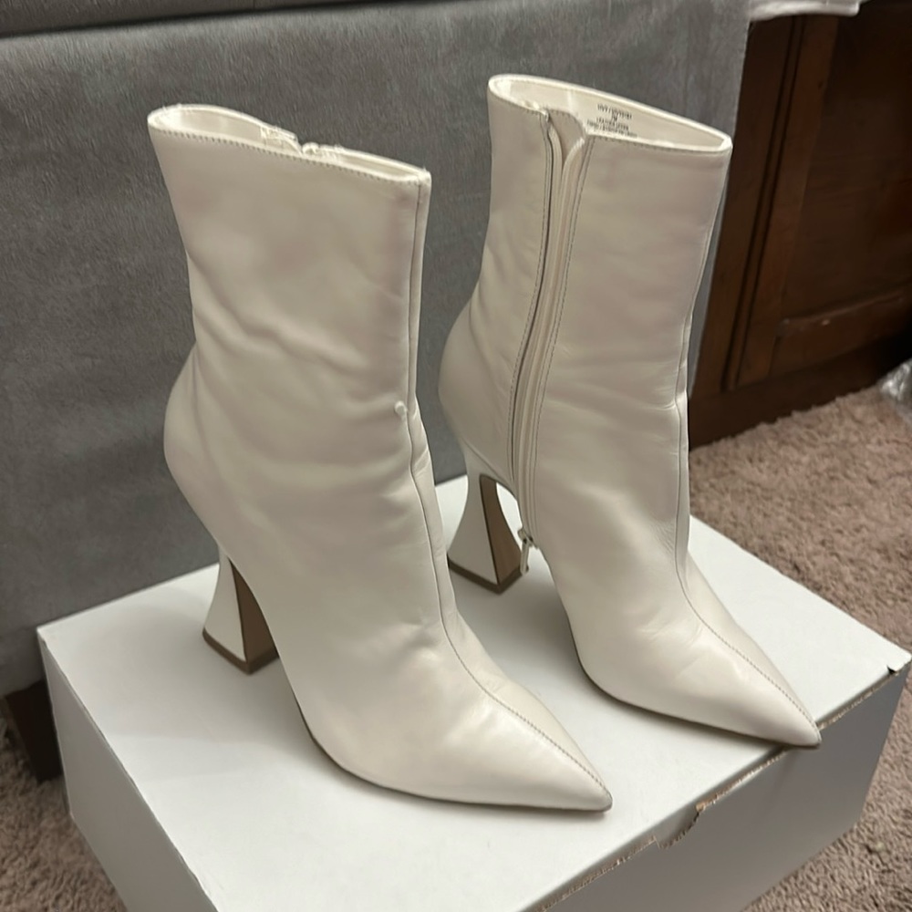 Steve Madden off white bootie with a 3.5inch flare heel.